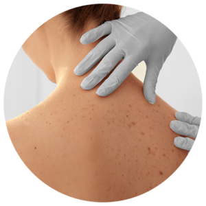 Medical professional examining a patients back and neck area